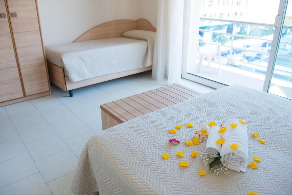 Postel nebo postele na pokoji v ubytování Hotel Giulietta