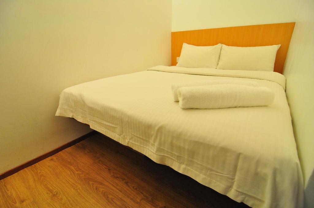 Postel nebo postele na pokoji v ubytování 1 Million Hotel