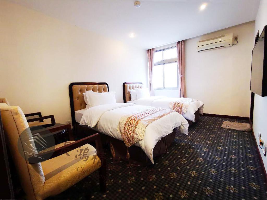 Postel nebo postele na pokoji v ubytování Chang Hong Hotel