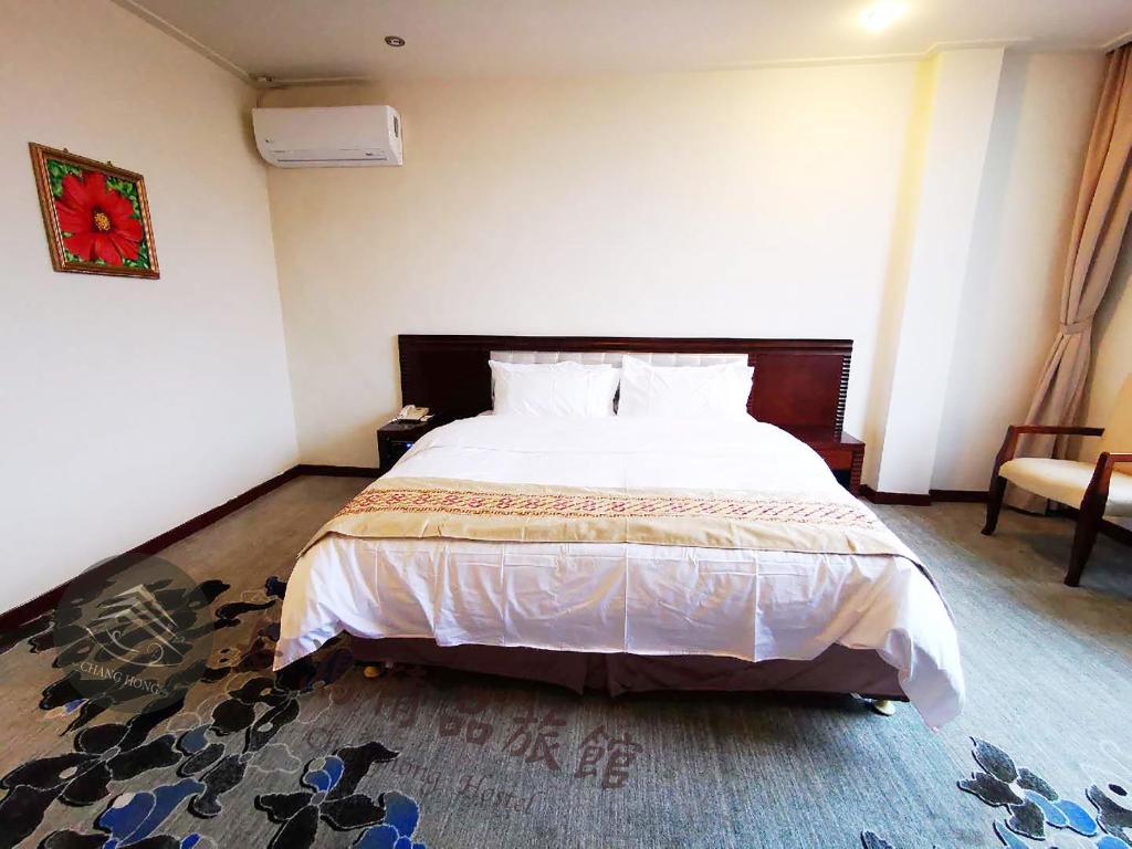 Postel nebo postele na pokoji v ubytování Chang Hong Hotel