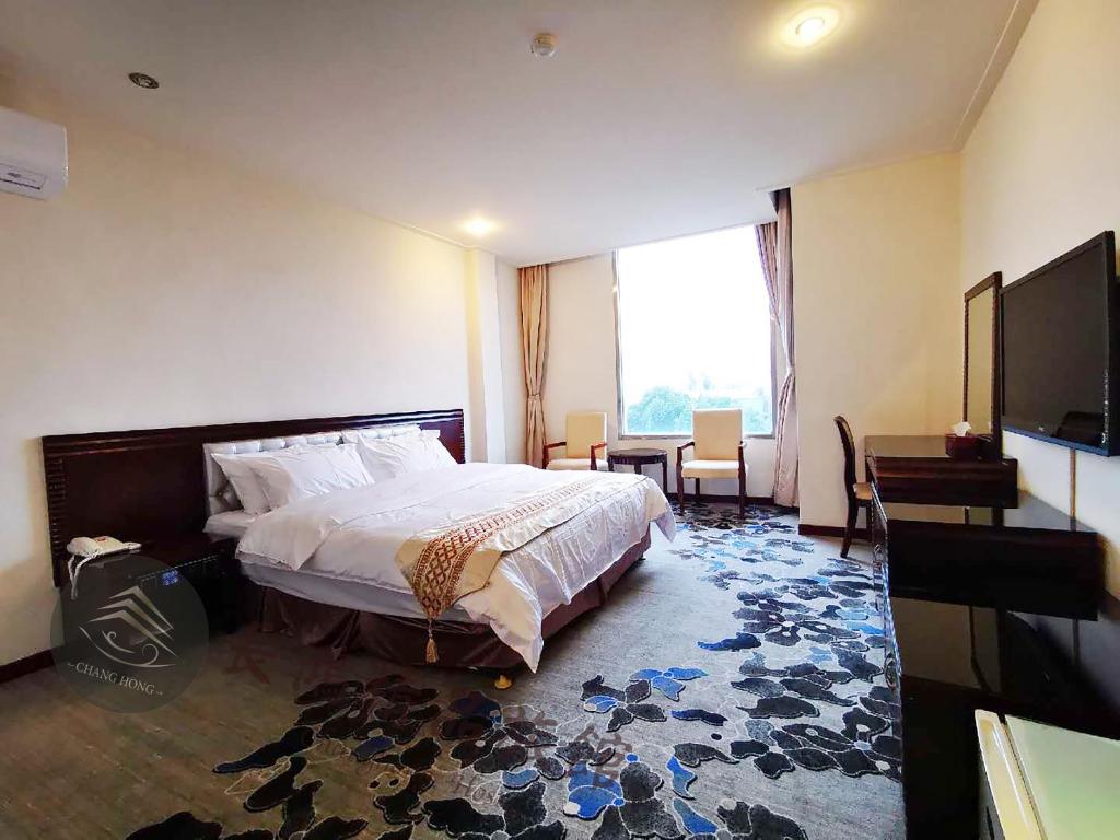 TV a/nebo společenská místnost v ubytování Chang Hong Hotel