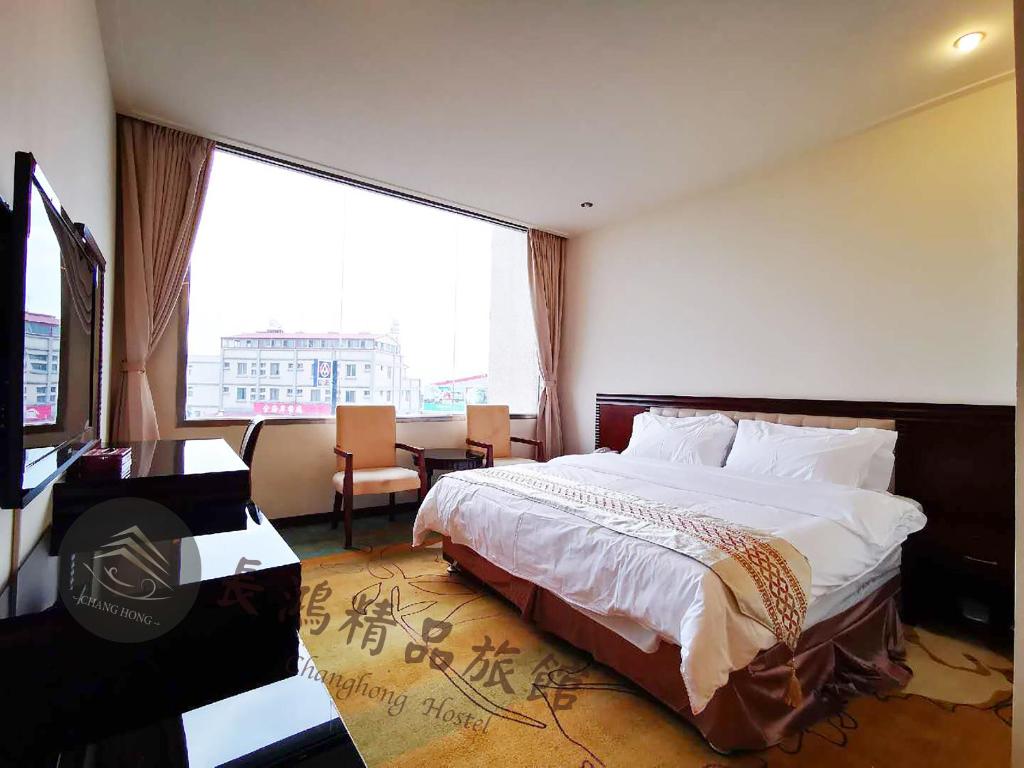 Postel nebo postele na pokoji v ubytování Chang Hong Hotel