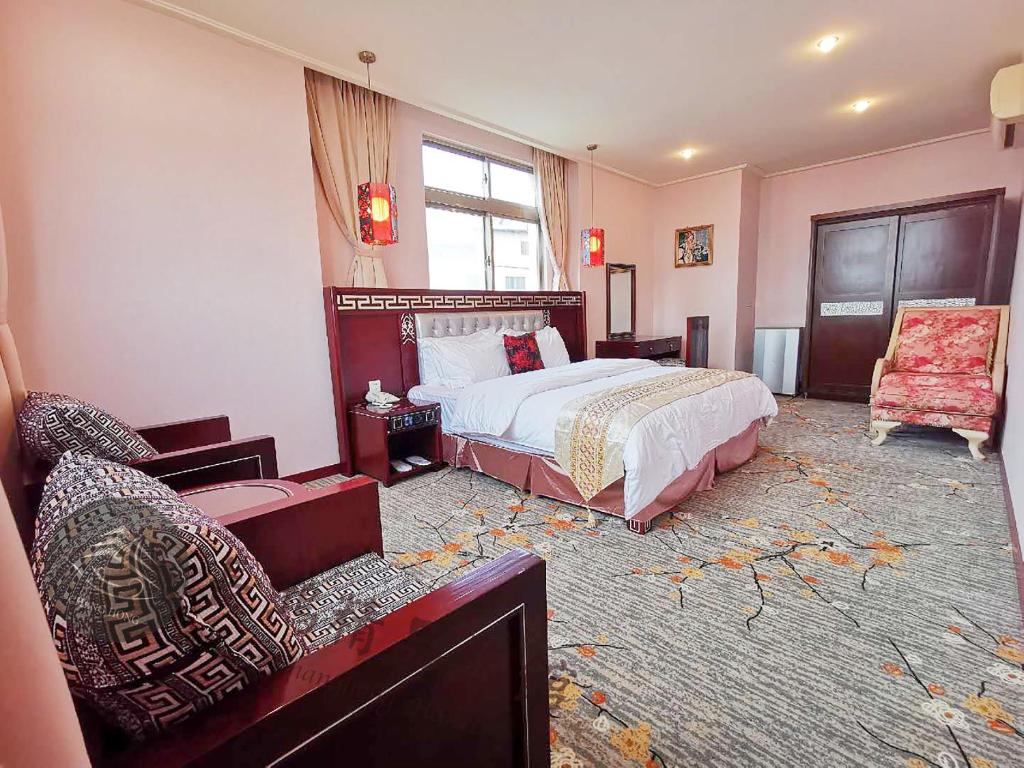 Postel nebo postele na pokoji v ubytování Chang Hong Hotel