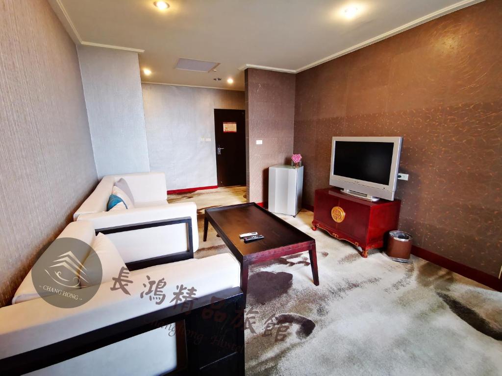 TV a/nebo společenská místnost v ubytování Chang Hong Hotel
