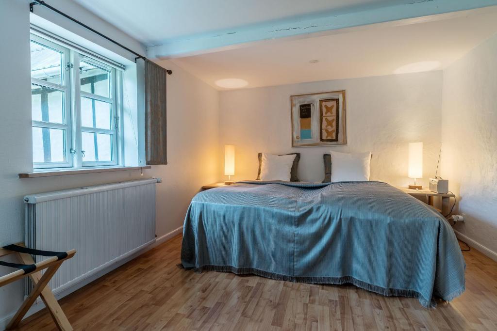 Postel nebo postele na pokoji v ubytování Vilcon Hotel & Konferencegaard
