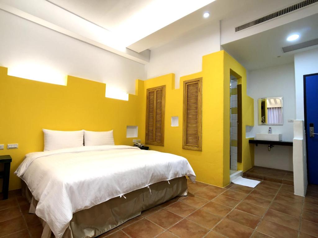 Voodi või voodid majutusasutuse Kenting True Color Hostel toas