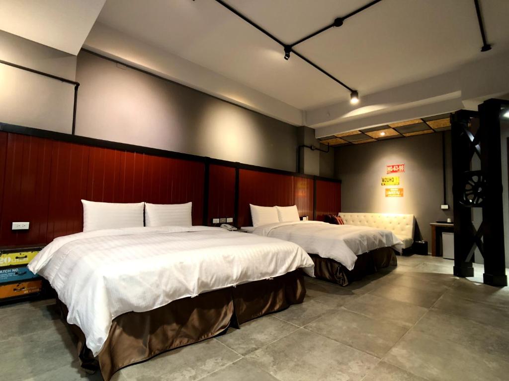 Voodi või voodid majutusasutuse Kenting True Color Hostel toas