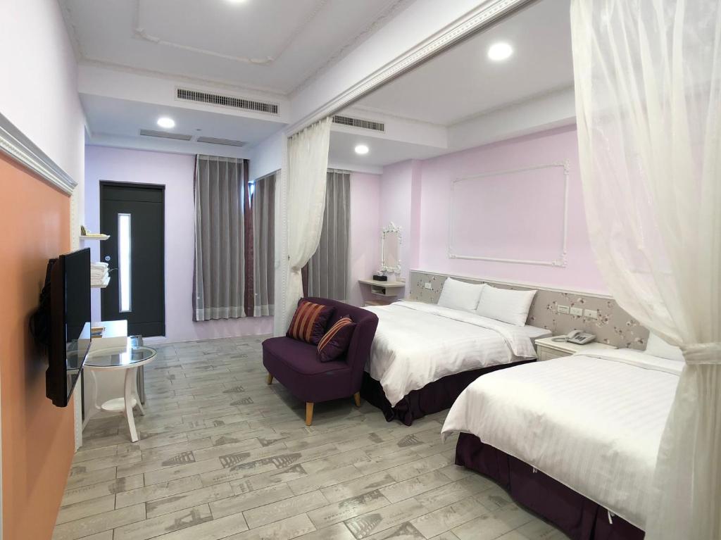 Voodi või voodid majutusasutuse Kenting True Color Hostel toas