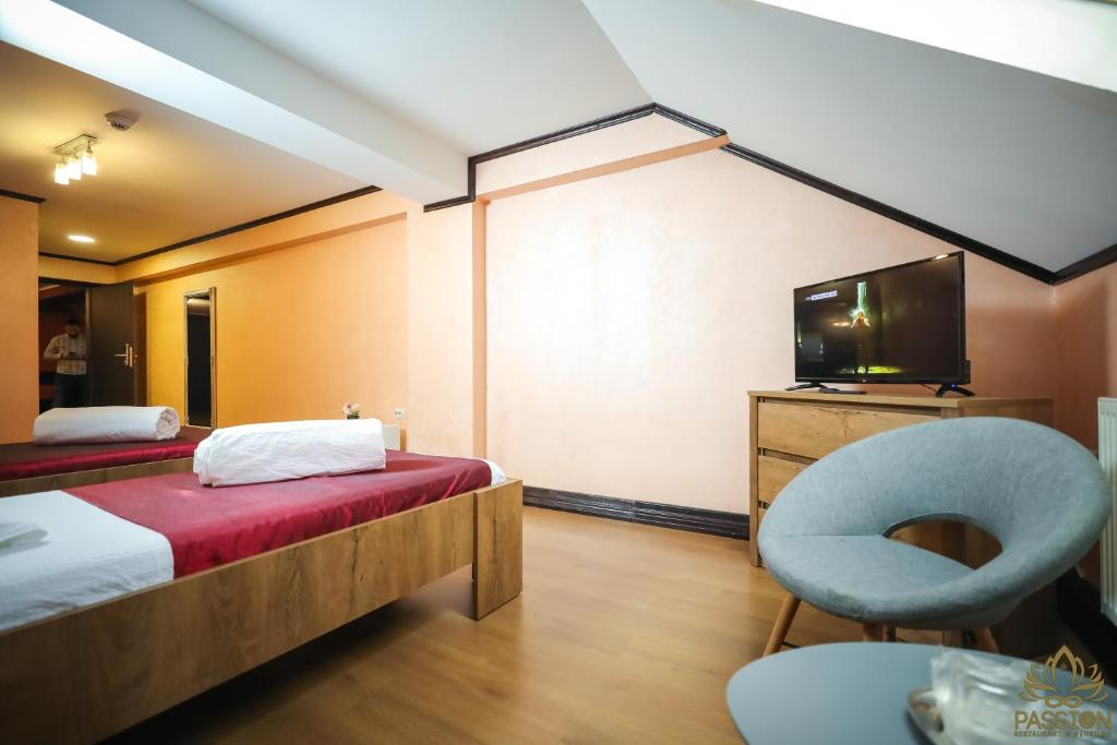 Кровать или кровати в номере Pensiunea Passion Club