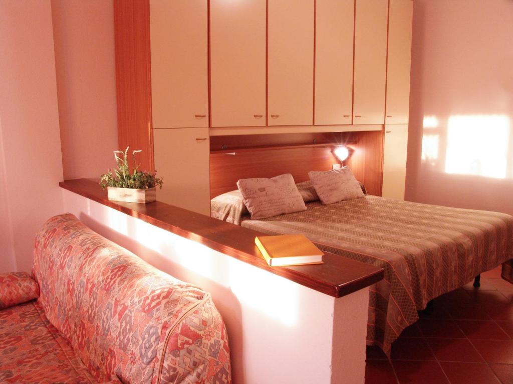 Łóżko lub łóżka w pokoju w obiekcie Agriturismo La Quiete