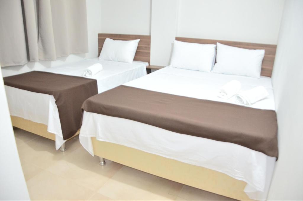 Postel nebo postele na pokoji v ubytování Hotel Sur Brasil