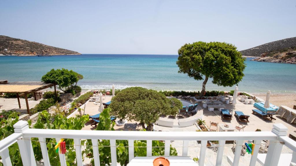 a view of the beach from the balcony of a resort at Pension Ageliki Sifnos in Platis Gialos