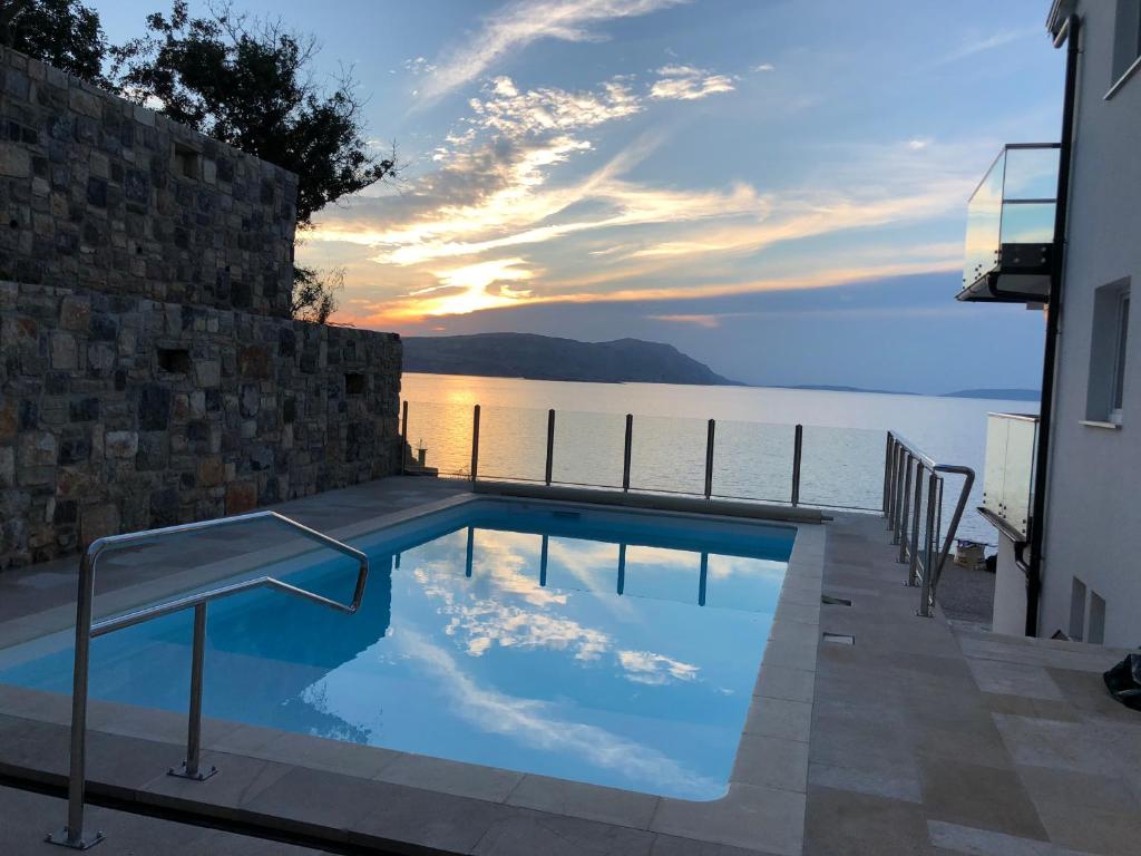 a swimming pool with a view of the water at 2Bfree in Stinica