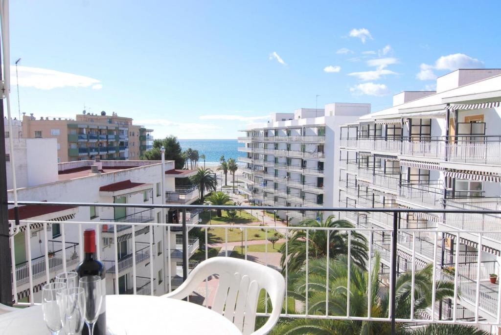 a balcony with a view of the ocean and buildings at Aries Basic in Salou