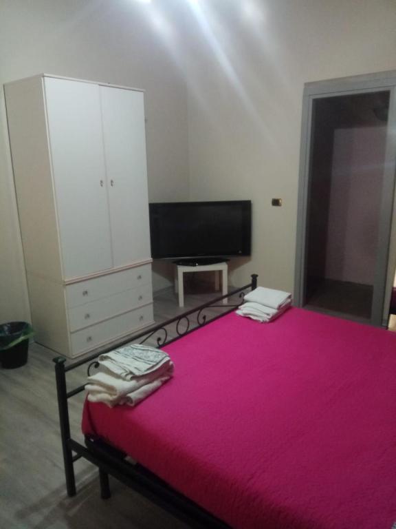 Un pat sau paturi într-o cameră la casa Giuseppe