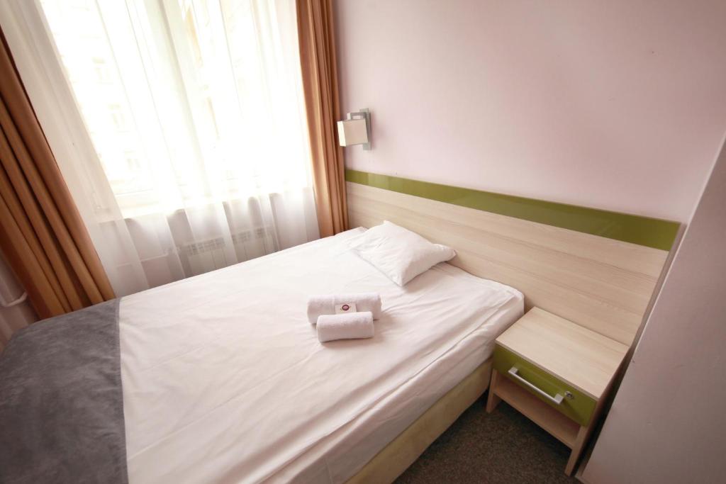 Postel nebo postele na pokoji v ubytování eMKa Hostel
