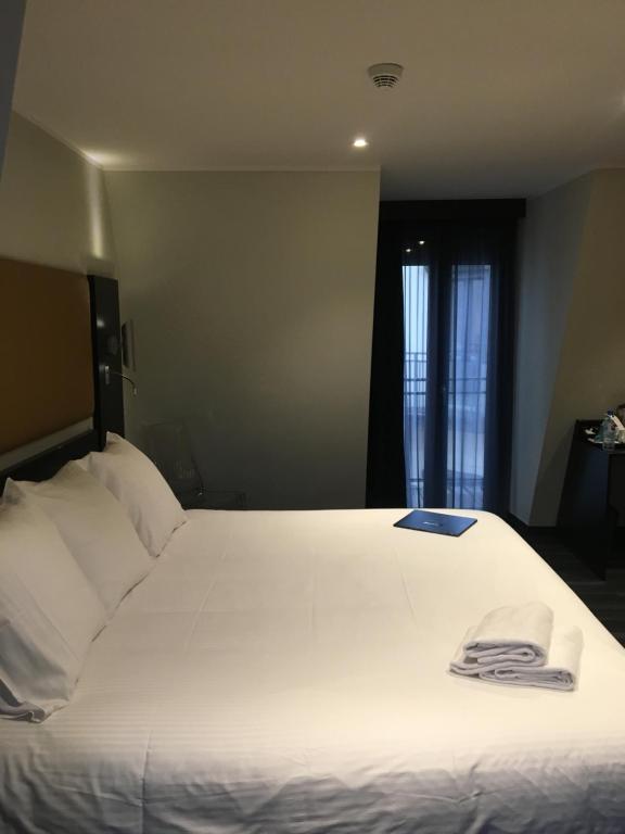 Postel nebo postele na pokoji v ubytování Hôtel Boutique Richelieu, Lyon Gare Part-Dieu