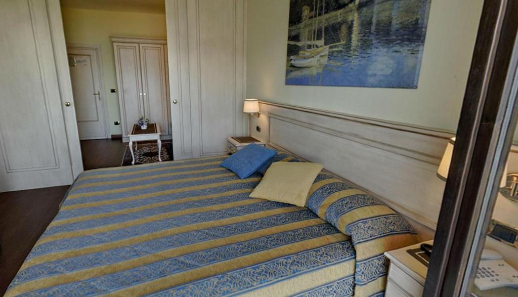Postel nebo postele na pokoji v ubytování Hotel Bellavista