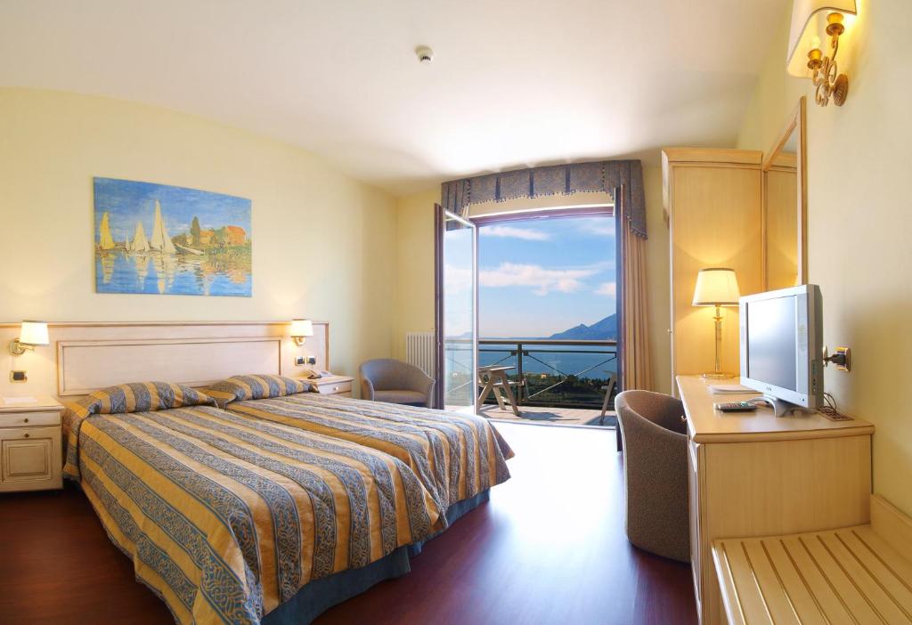 Postel nebo postele na pokoji v ubytování Hotel Bellavista