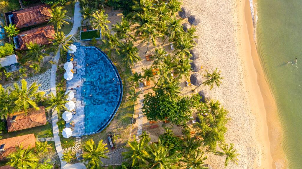 an aerial view of a resort with a swimming pool and a beach at Thanh Kieu Beach Resort in Phú Quốc