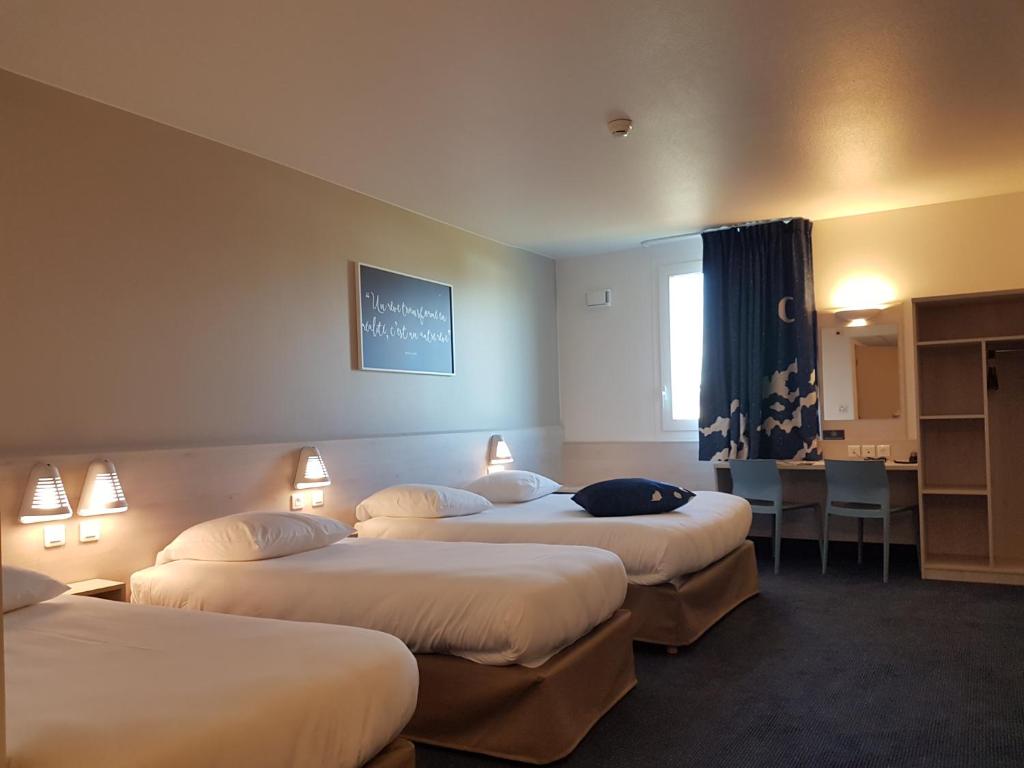 Postel nebo postele na pokoji v ubytování Ace Hôtel Toulouse Blagnac