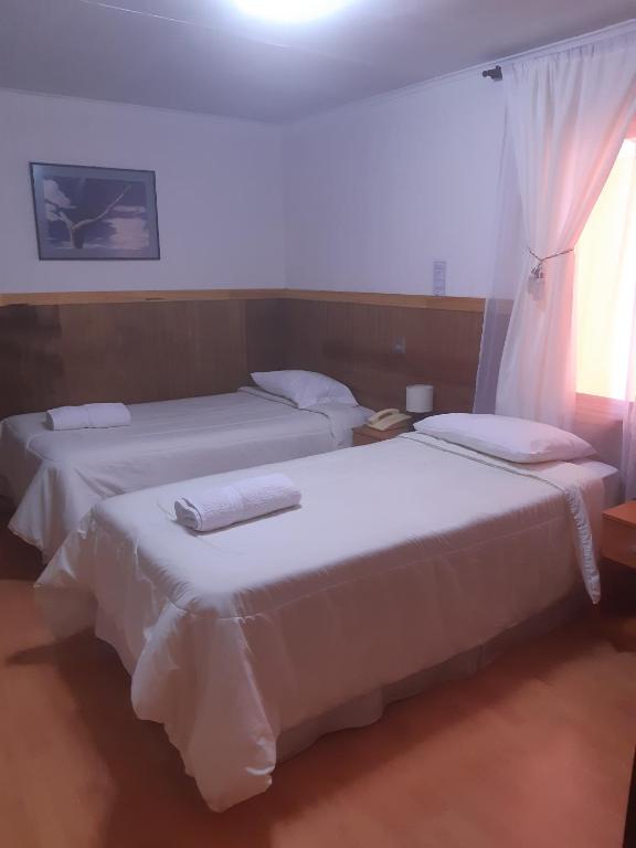 Postel nebo postele na pokoji v ubytování Agostini Hotel