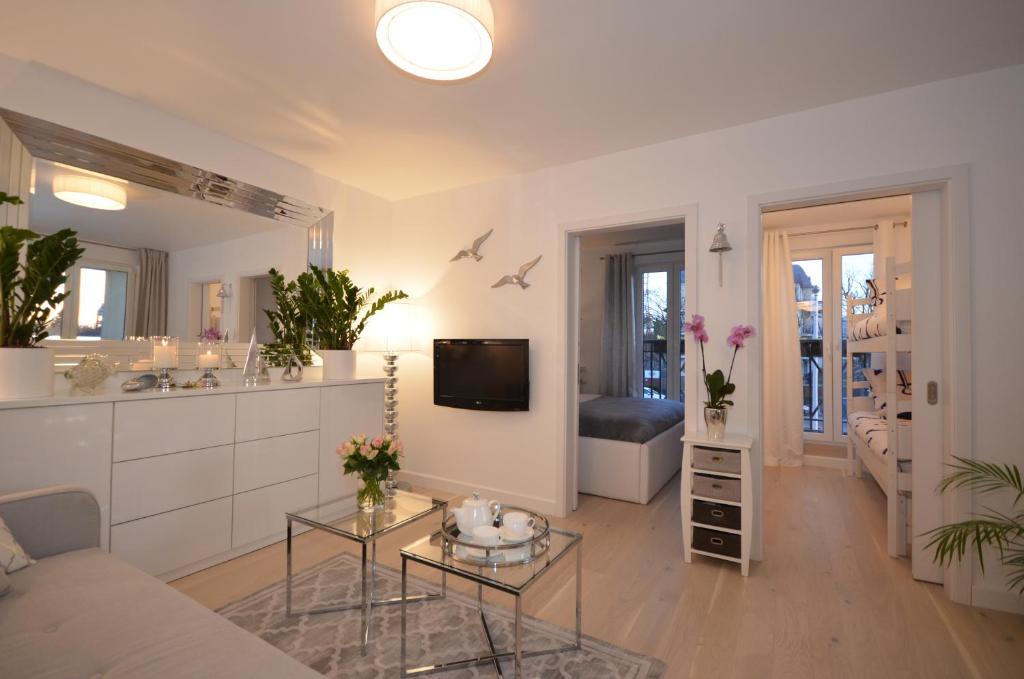 Televízia a/alebo spoločenská miestnosť v ubytovaní Luksusowy Apartament na Promenadzie