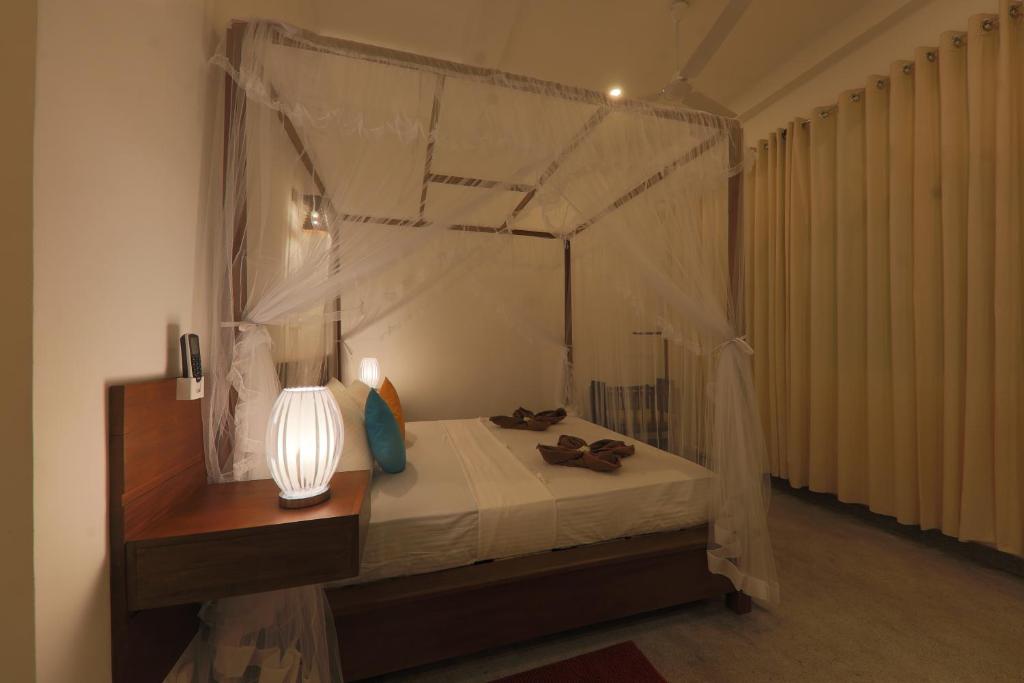 Postel nebo postele na pokoji v ubytování Beach Grove Villas