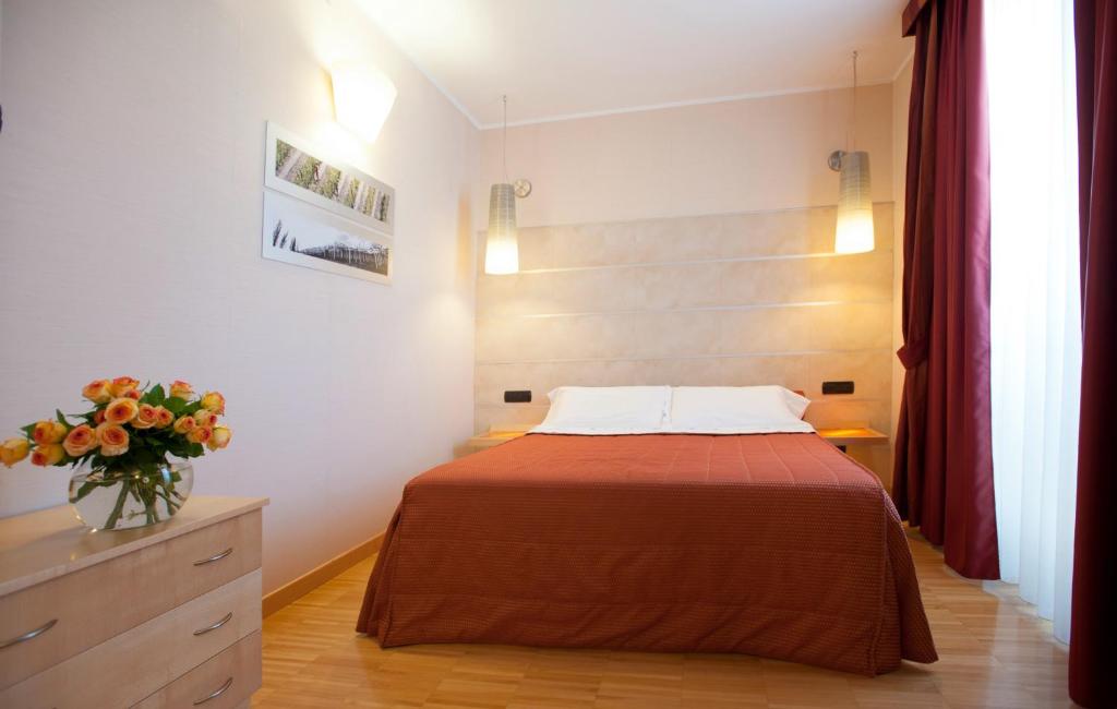 Posteľ alebo postele v izbe v ubytovaní AlbaResidence Masera26