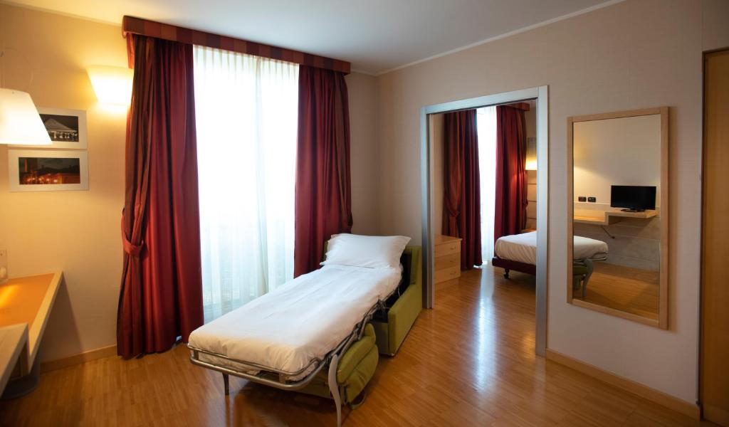 Posteľ alebo postele v izbe v ubytovaní AlbaResidence Masera26