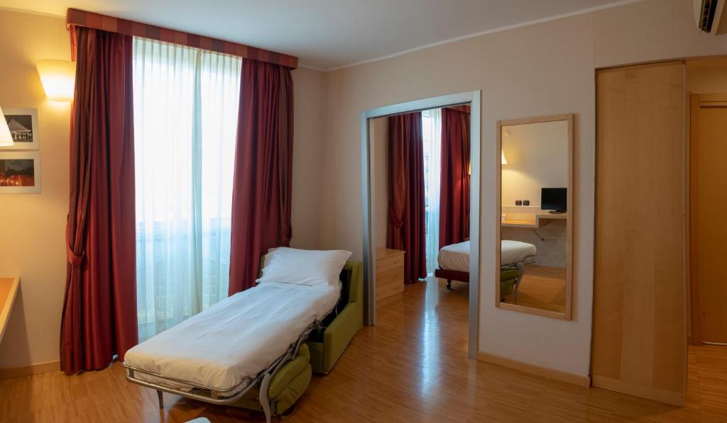 Posteľ alebo postele v izbe v ubytovaní AlbaResidence Masera26