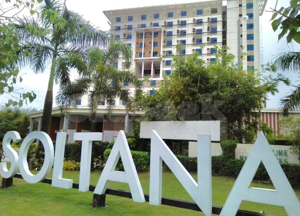 a sign for thessaloniki in front of a building at Stunning Tropical resort condo in Mactan