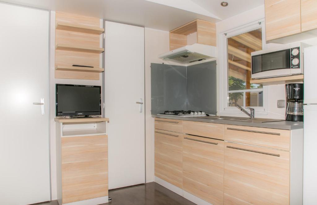 Kuchyň nebo kuchyňský kout v ubytování Camping Ametlla