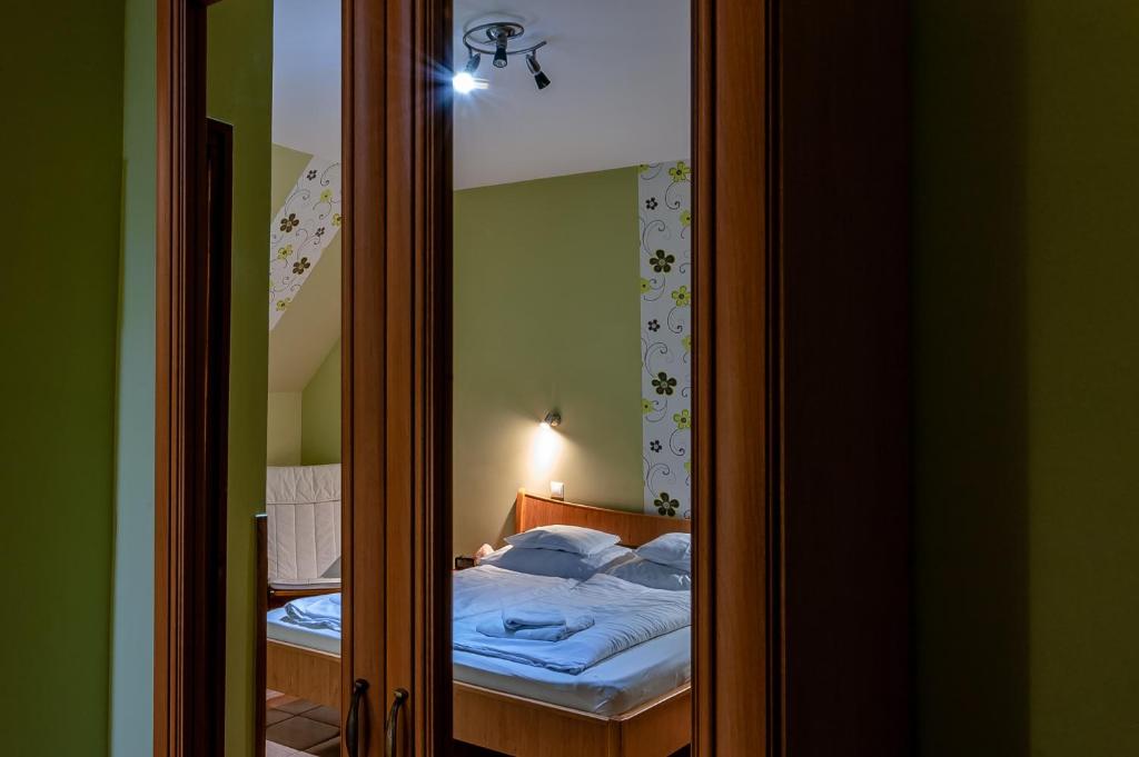 Posteľ alebo postele v izbe v ubytovaní Bástya Hotel