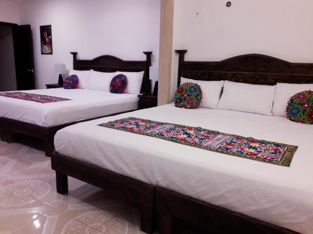 Postel nebo postele na pokoji v ubytování Hotel Peregrina