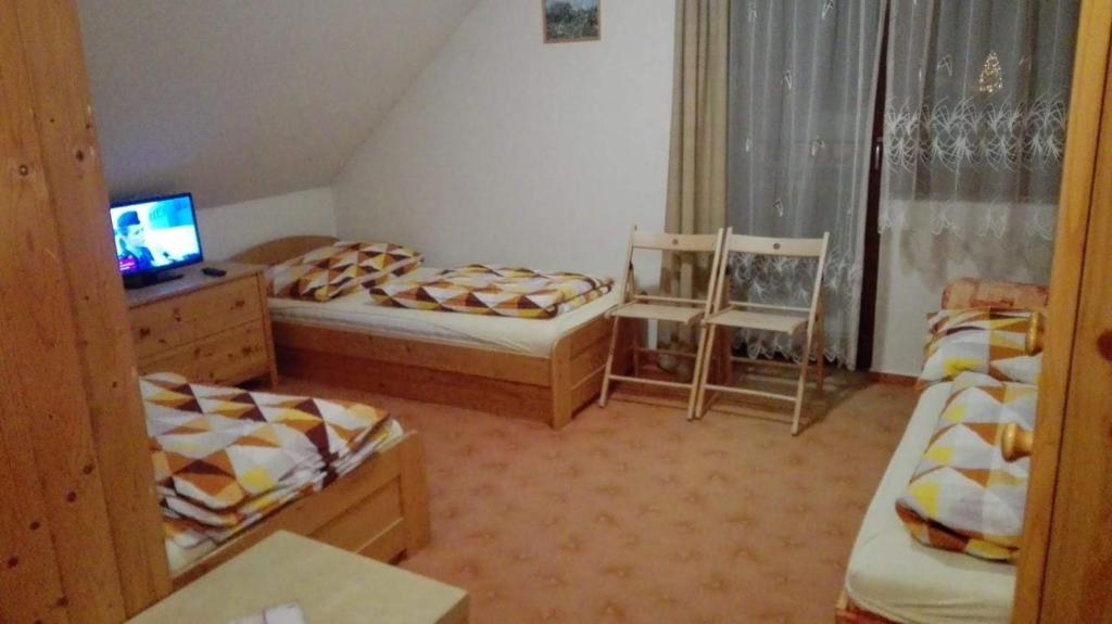 Postel nebo postele na pokoji v ubytování Pod Smrcinou