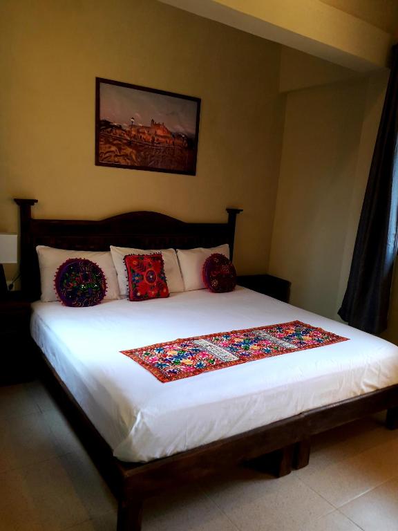 Postel nebo postele na pokoji v ubytování Hotel Peregrina