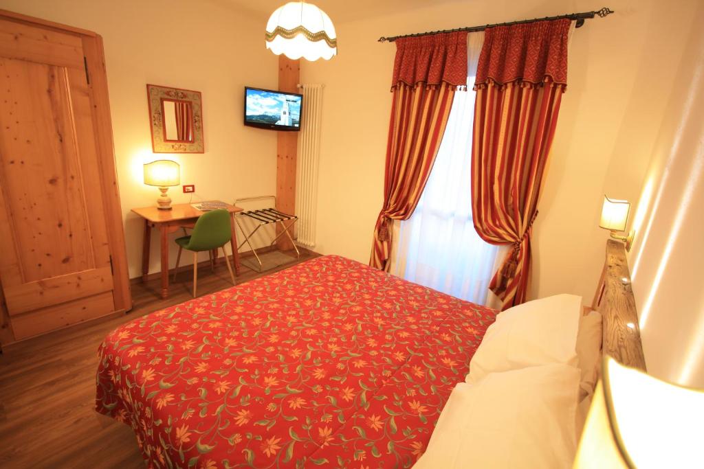 Postel nebo postele na pokoji v ubytování Hotel Trieste