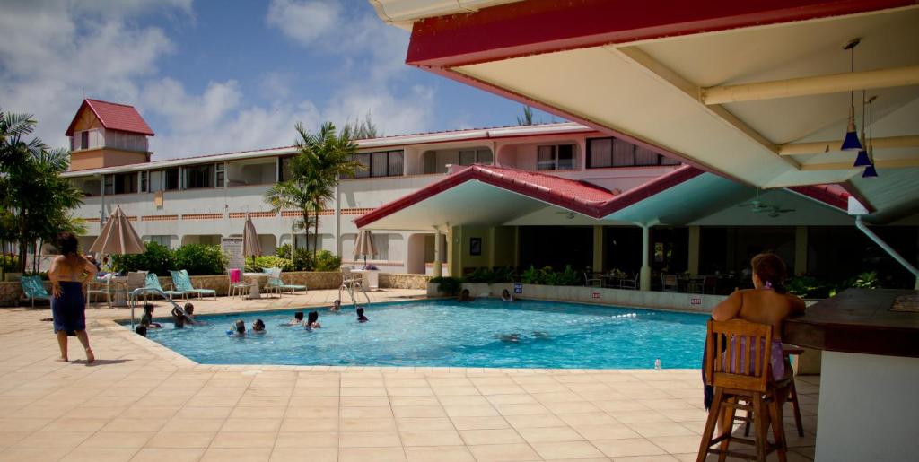 a group of people in a pool at a hotel at Crown Point Beach Hotel in Crown Point