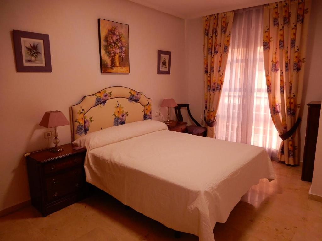 Posteľ alebo postele v izbe v ubytovaní Edificio 1º línea de playa, en paseo marítimo de Torrevieja, Alicante, Costa Blanca