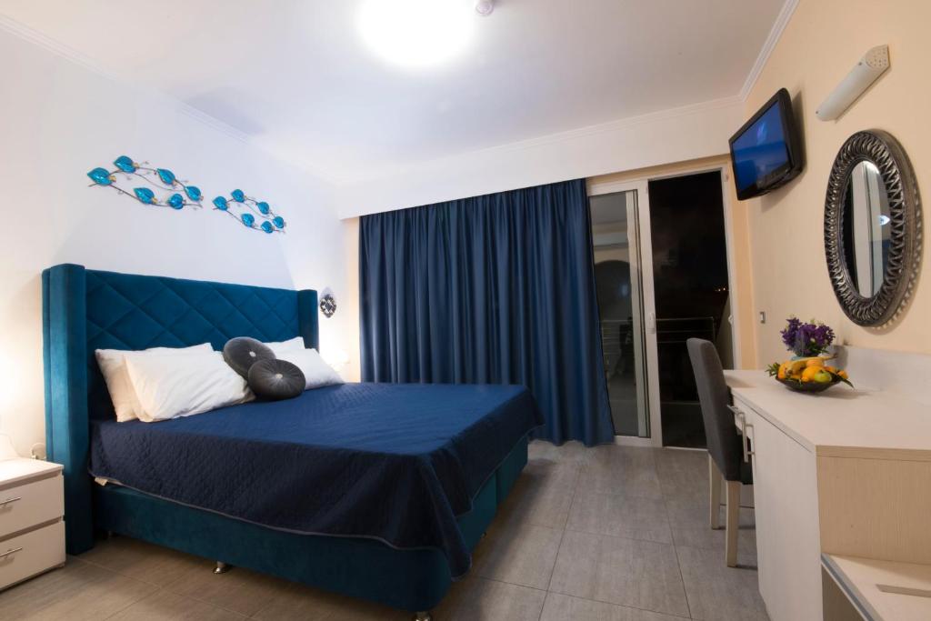 Letto o letti in una camera di Hotel Kalithea