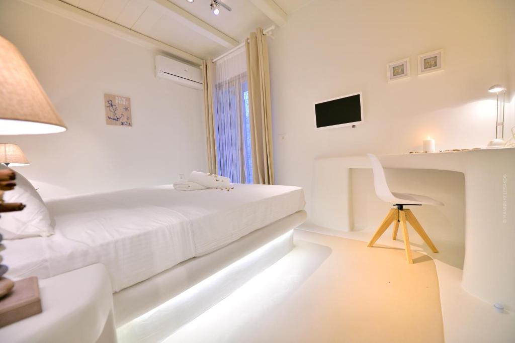 Łóżko lub łóżka w pokoju w obiekcie Villa Kimothoe by Thalassa Residence Mykonos