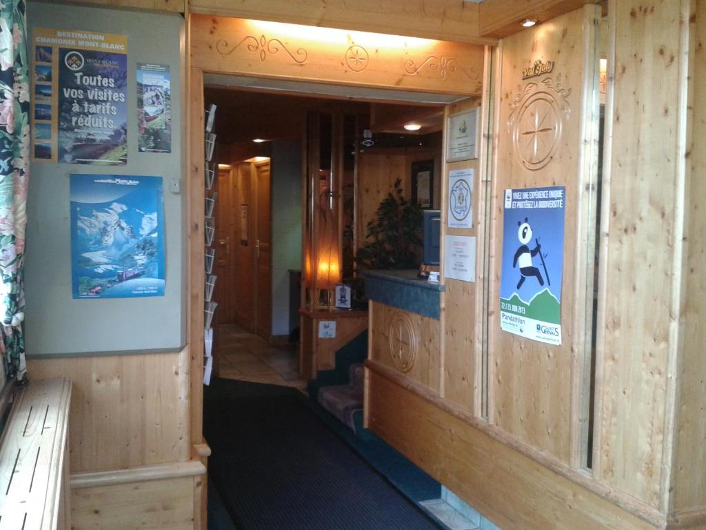 an entrance to a building with wooden walls at Hotel Val Joly in Saint-Gervais-les-Bains