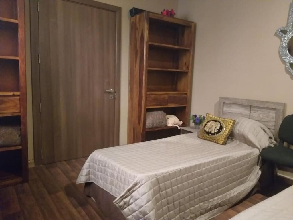 Postel nebo postele na pokoji v ubytování Lotus Guest House Malta