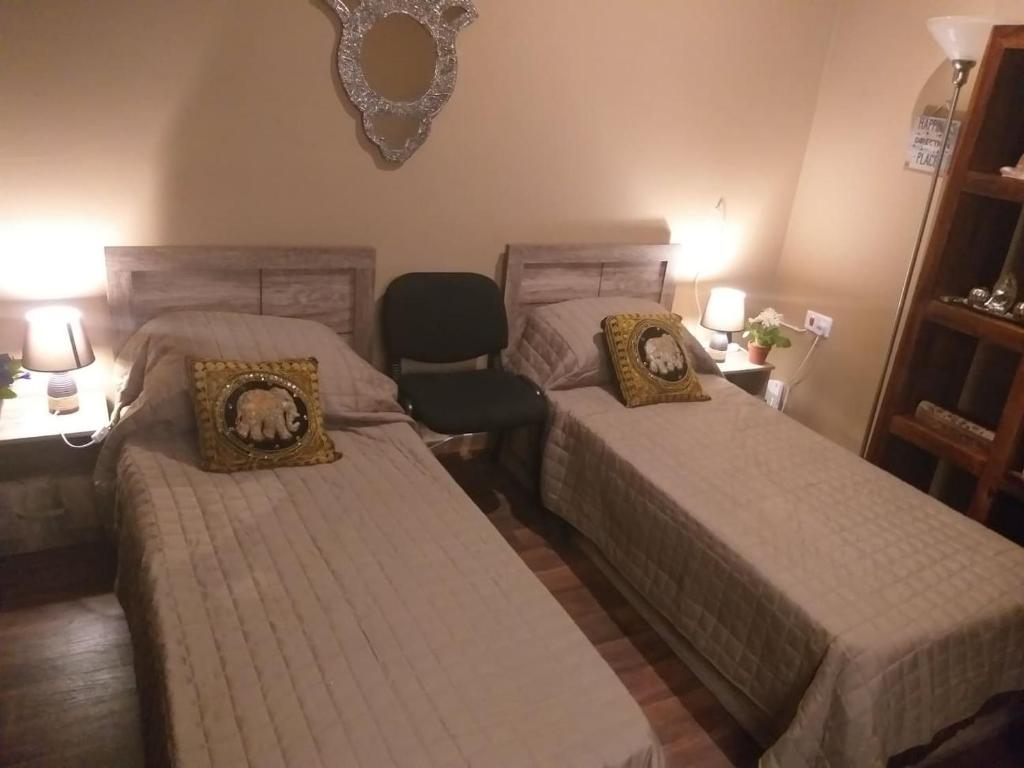 Postel nebo postele na pokoji v ubytování Lotus Guest House Malta