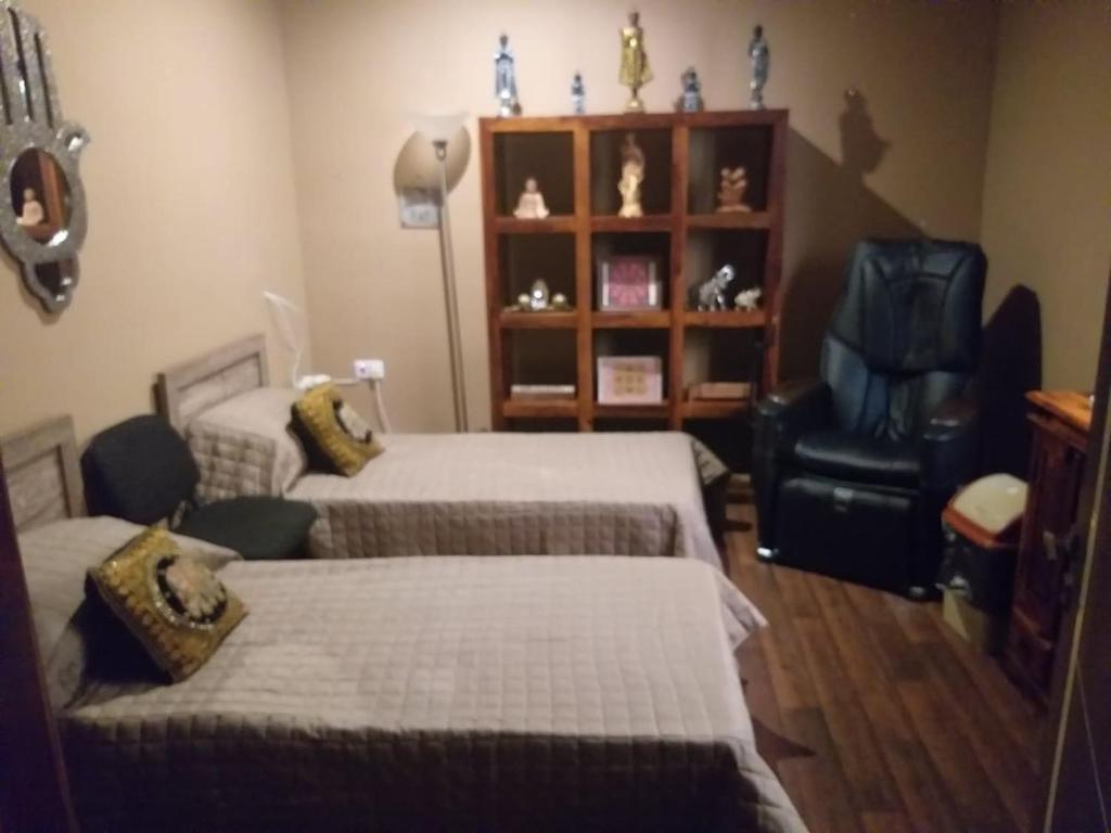Postel nebo postele na pokoji v ubytování Lotus Guest House Malta