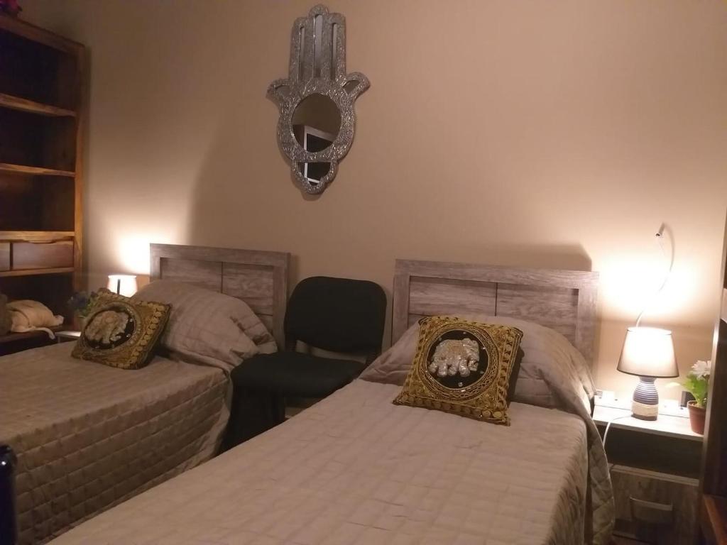 Postel nebo postele na pokoji v ubytování Lotus Guest House Malta