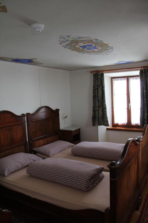 Een bed of bedden in een kamer bij Albergo San Gottardo