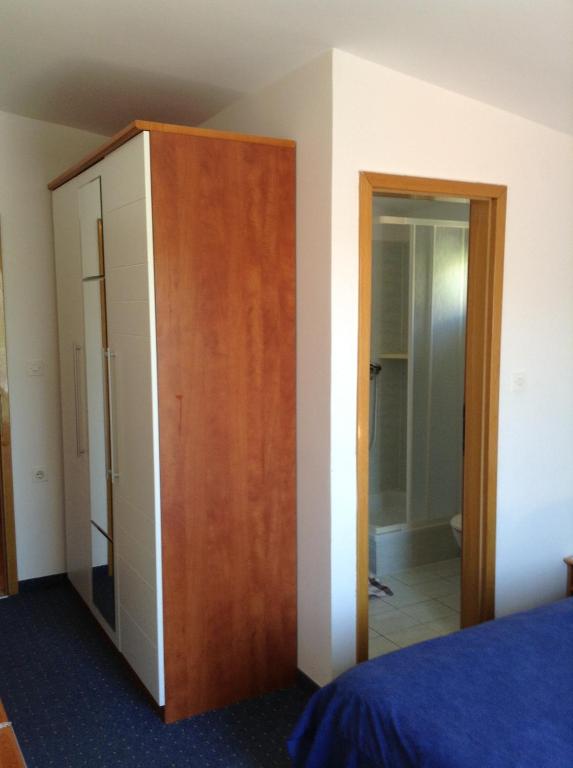 Postel nebo postele na pokoji v ubytování Pansion Laguna