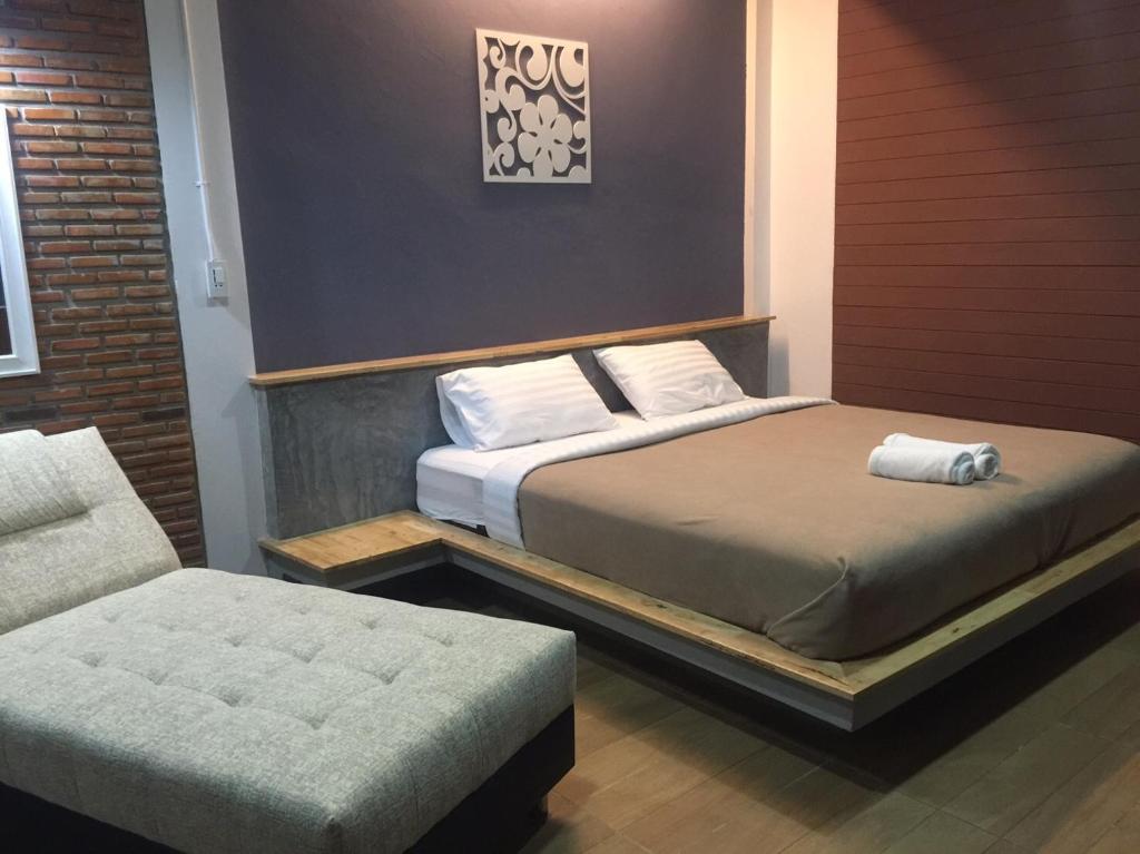 Postel nebo postele na pokoji v ubytování The C Hotel